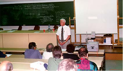 Ron Dunkley addresses the WFNMC meeting in Seville, Spain, in July 1996. Professor Dunkley was elected President of WFNMC at this meeting, where a Constitution was approved for the first time.